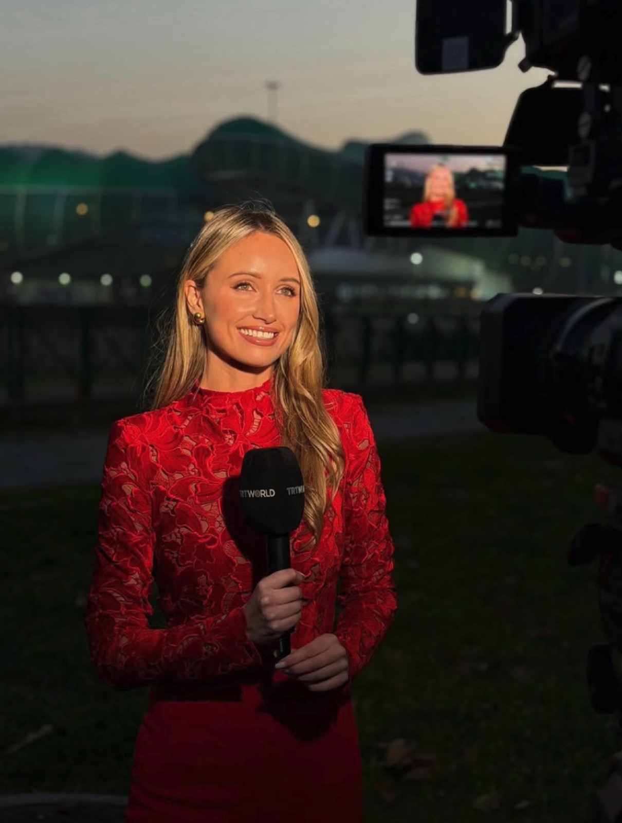 Charlotte Bates reporting on camera at a major stadium event