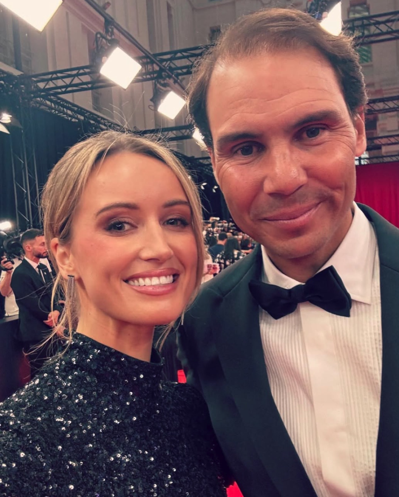 Charlotte Bates at a sports broadcasting awards gala in a formal black dress